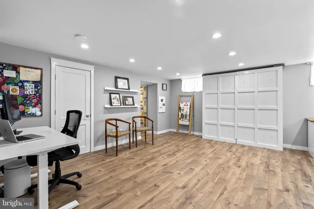 a view of a workspace with furniture and workspace