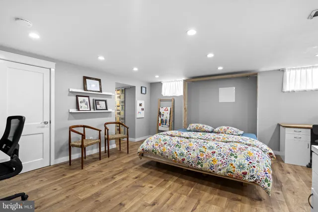 a bedroom with a bed and with furniture