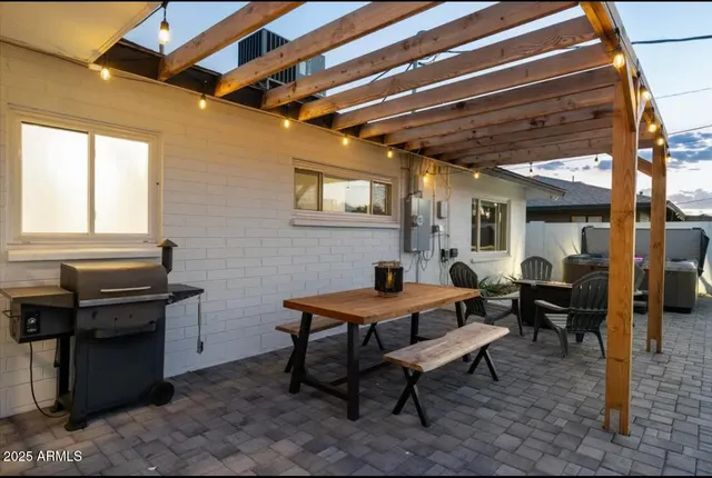 a view of a backyard with sitting area