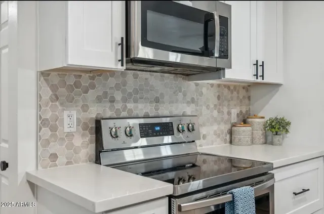 a kitchen with a stove and a microwave
