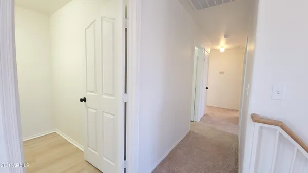 a view of a hallway with a shower
