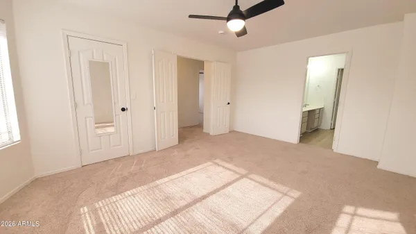 a view of an empty room with a bathroom