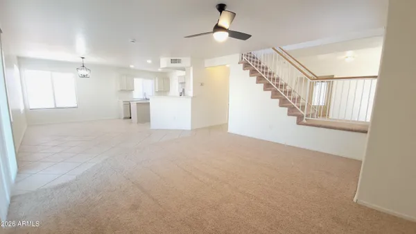 a view of a big room with closet and a living room