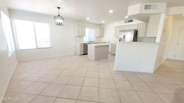 a view of a kitchen with furniture and window