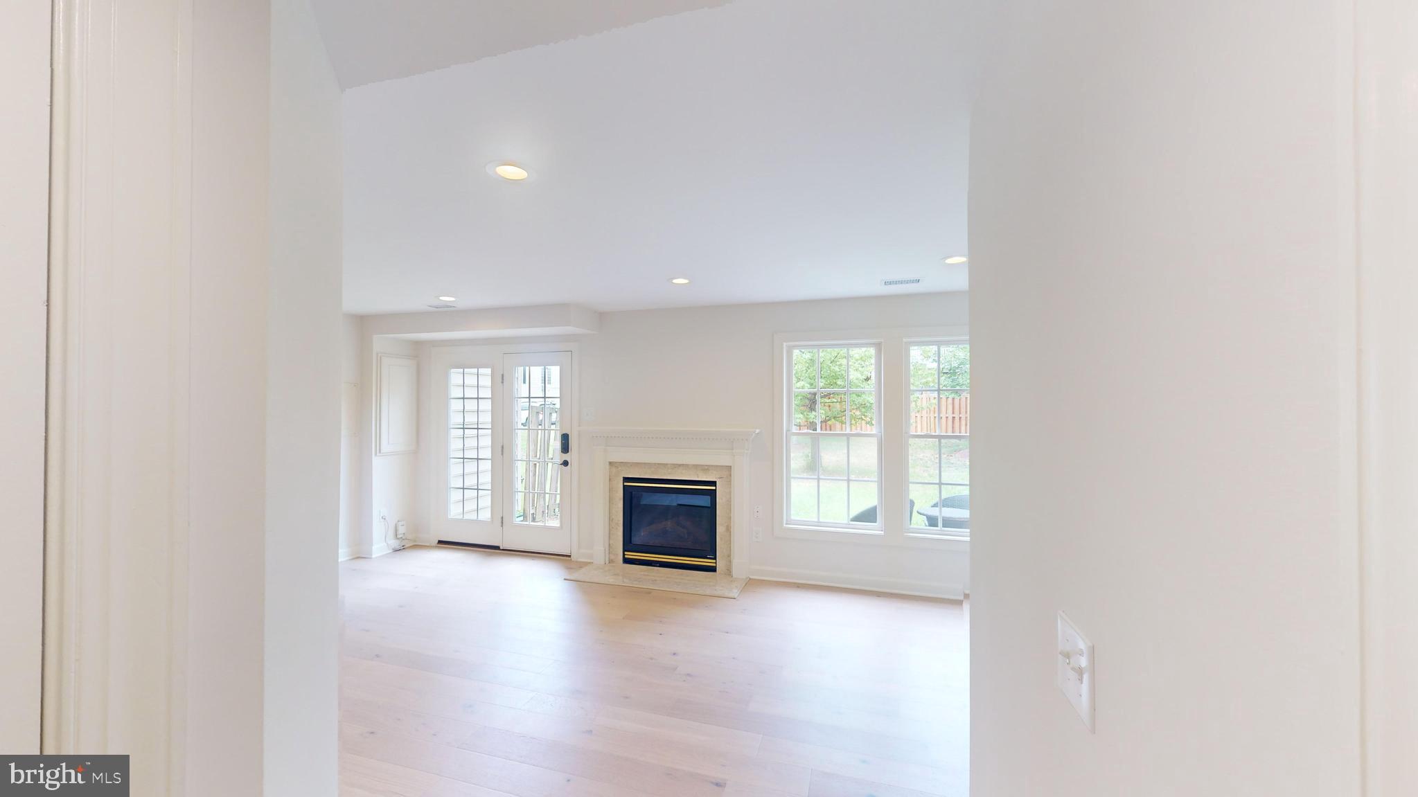 41836 Proverbial Terrace Aldie, VA 20105 - Photo 23 of 25 an empty room with windows and fireplace