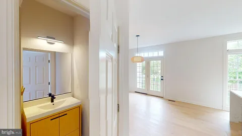 a view of a bathroom with a tub sink and mirror