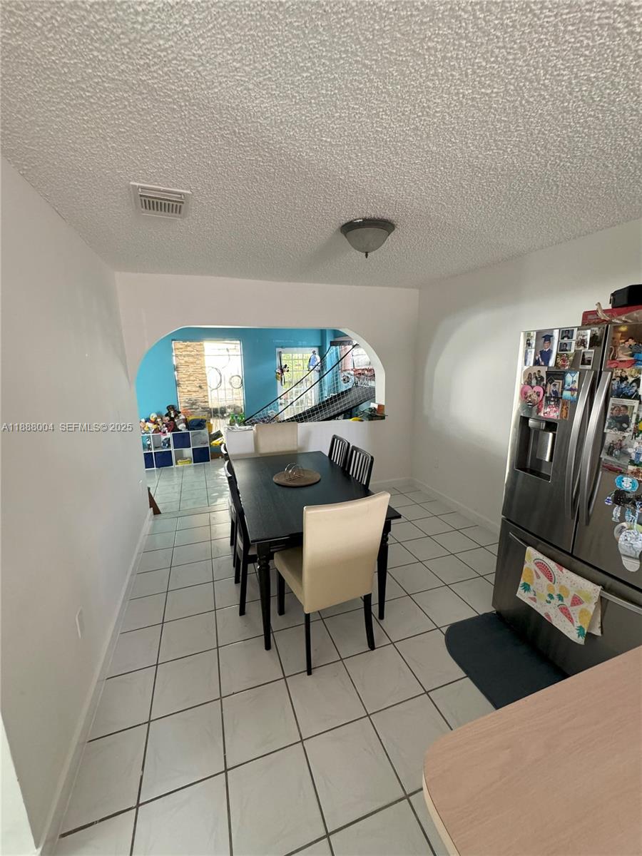 20923 Southwest 126th Court Miami, FL 33177 - Photo 13 of 19 a view of a dining room with furniture