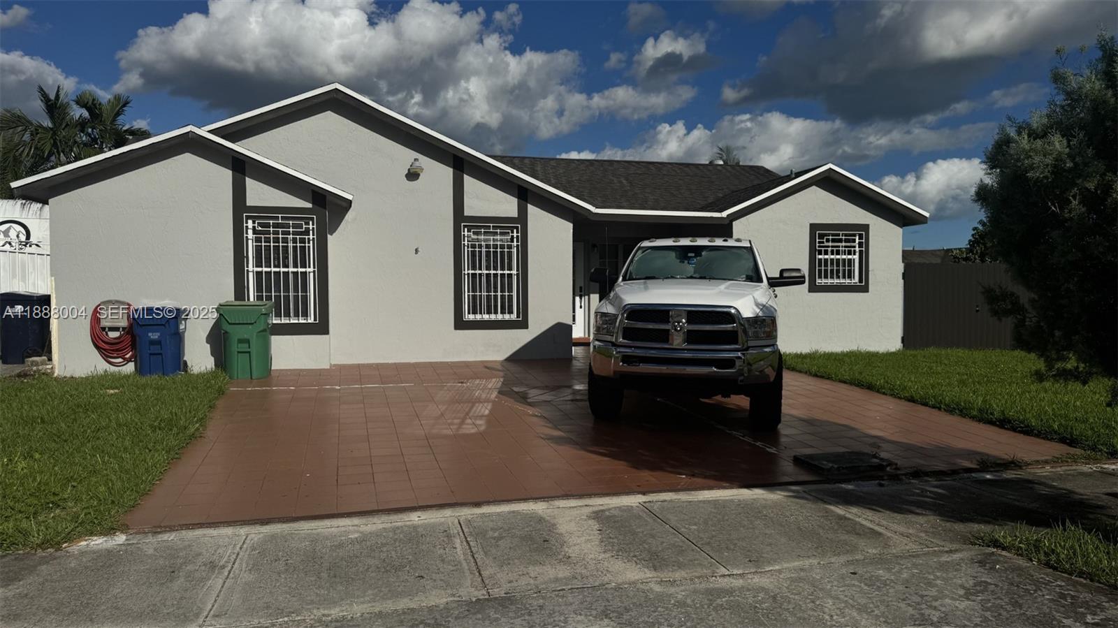 20923 Southwest 126th Court Miami, FL 33177 - Photo 4 of 19 a house view with a outdoor space