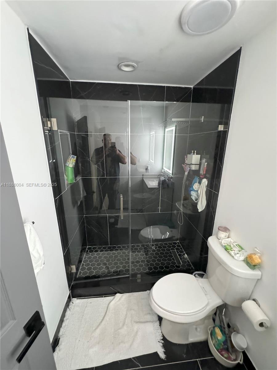 20923 Southwest 126th Court Miami, FL 33177 - Photo 9 of 19 a bathroom with a toilet and a shower