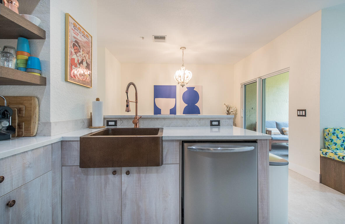 1910 Coastal Bay Boulevard Boynton Beach, FL 33435 - Photo 12 of 64 a view of living room with granite countertop furniture and a fireplace