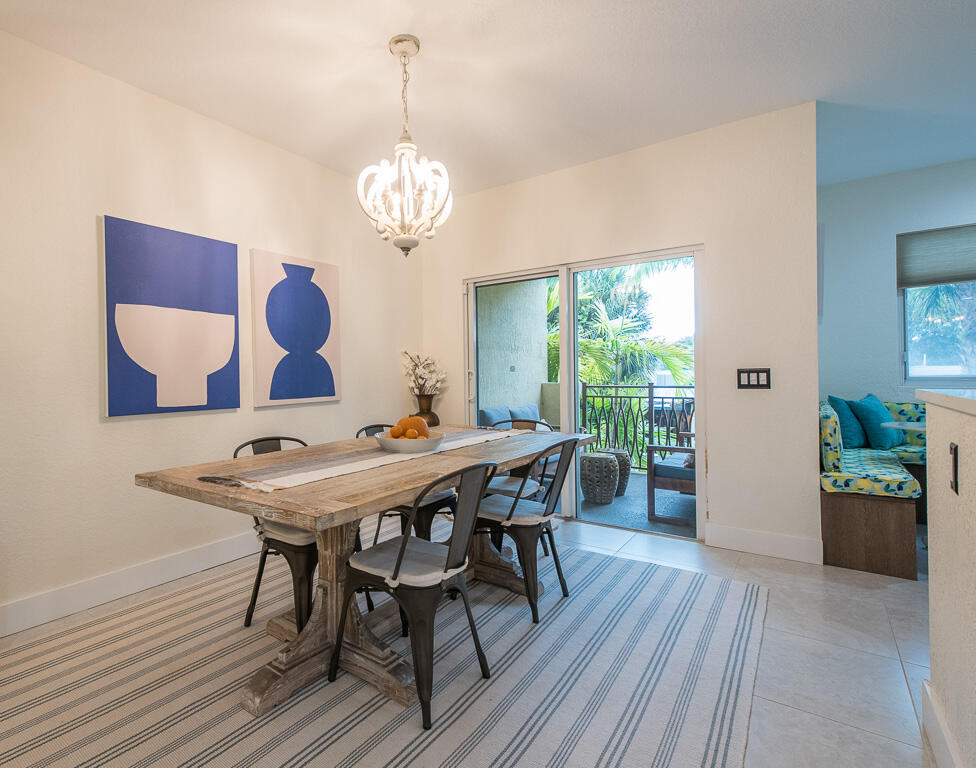 1910 Coastal Bay Boulevard Boynton Beach, FL 33435 - Photo 19 of 64 a view of a dining room with furniture window and wooden floor