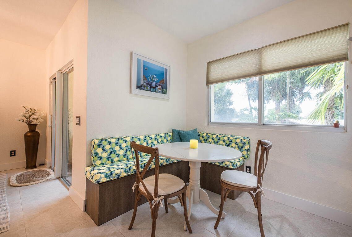 1910 Coastal Bay Boulevard Boynton Beach, FL 33435 - Photo 21 of 64 a view of a dining room with furniture and a window