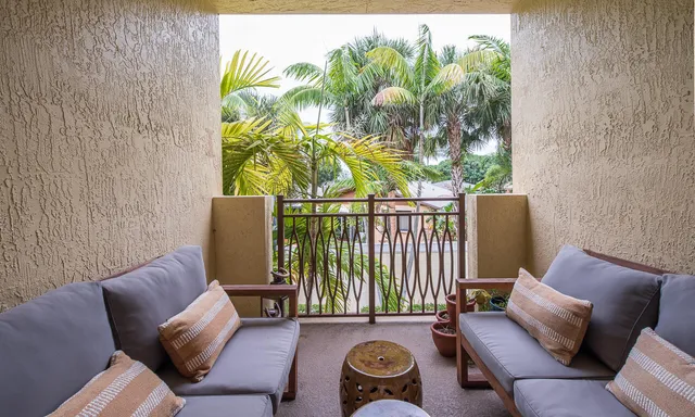 a bedroom with a bed couch and window