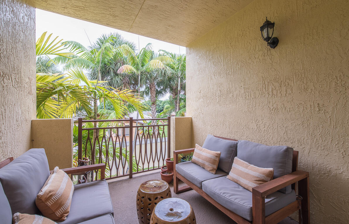 1910 Coastal Bay Boulevard Boynton Beach, FL 33435 - Photo 23 of 64 a living room with furniture and a window