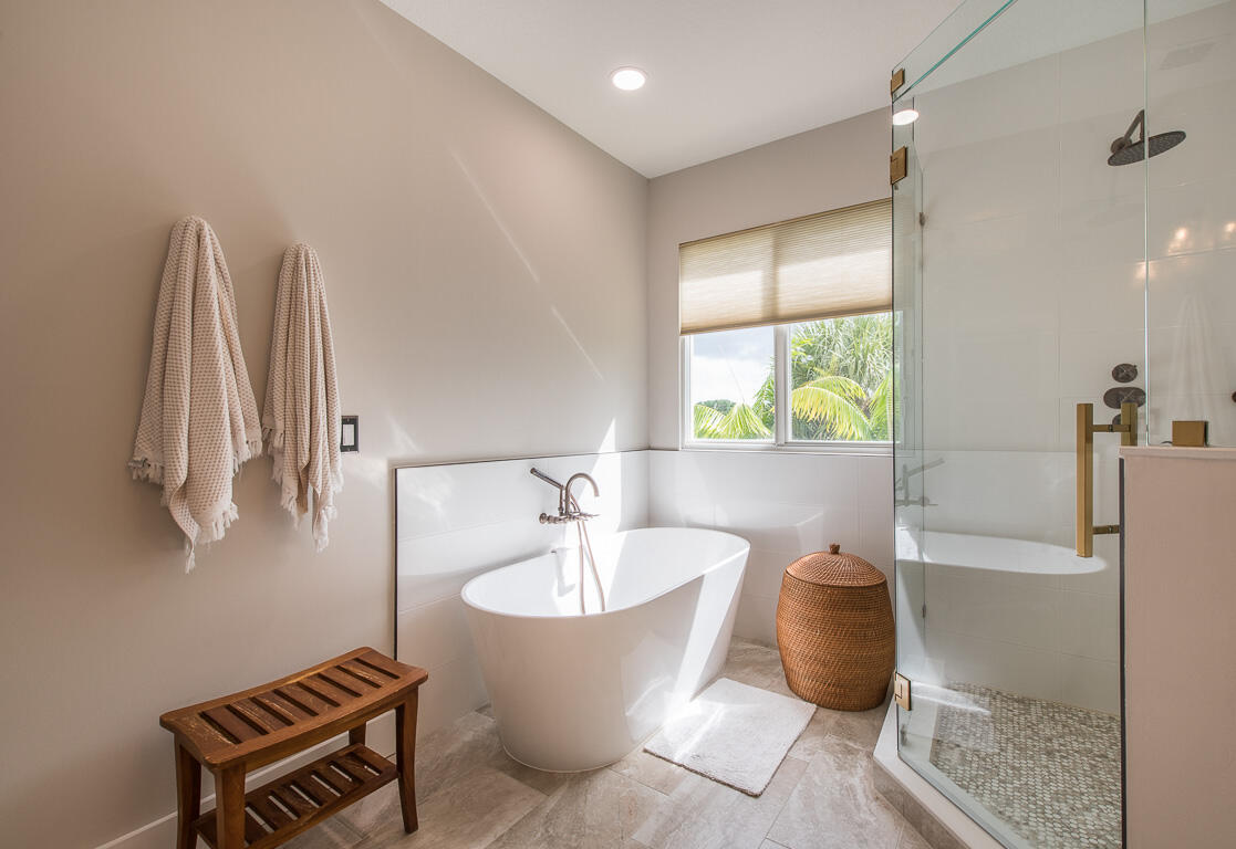1910 Coastal Bay Boulevard Boynton Beach, FL 33435 - Photo 32 of 64 a bathroom with a bathtub and a shower