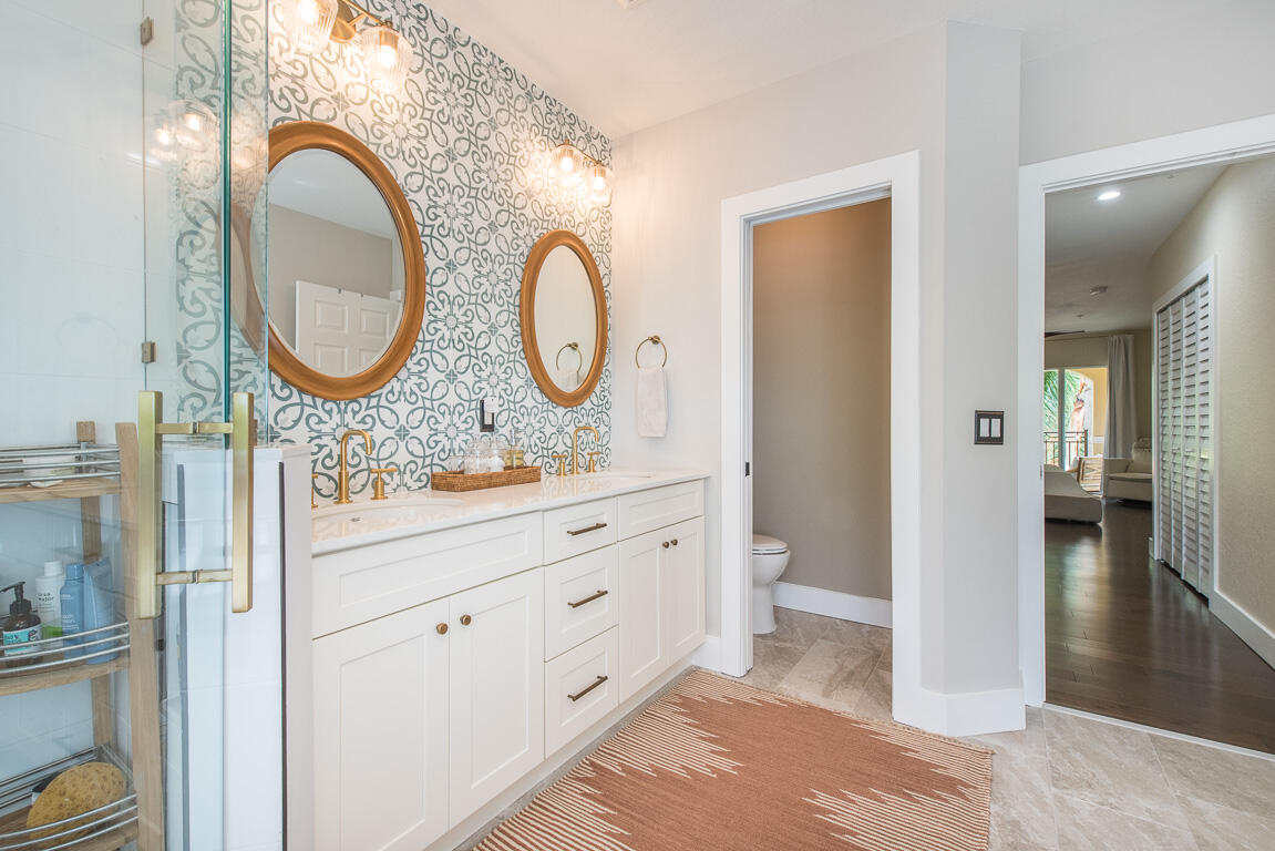 1910 Coastal Bay Boulevard Boynton Beach, FL 33435 - Photo 34 of 64 a bathroom with a granite countertop sink and a mirror