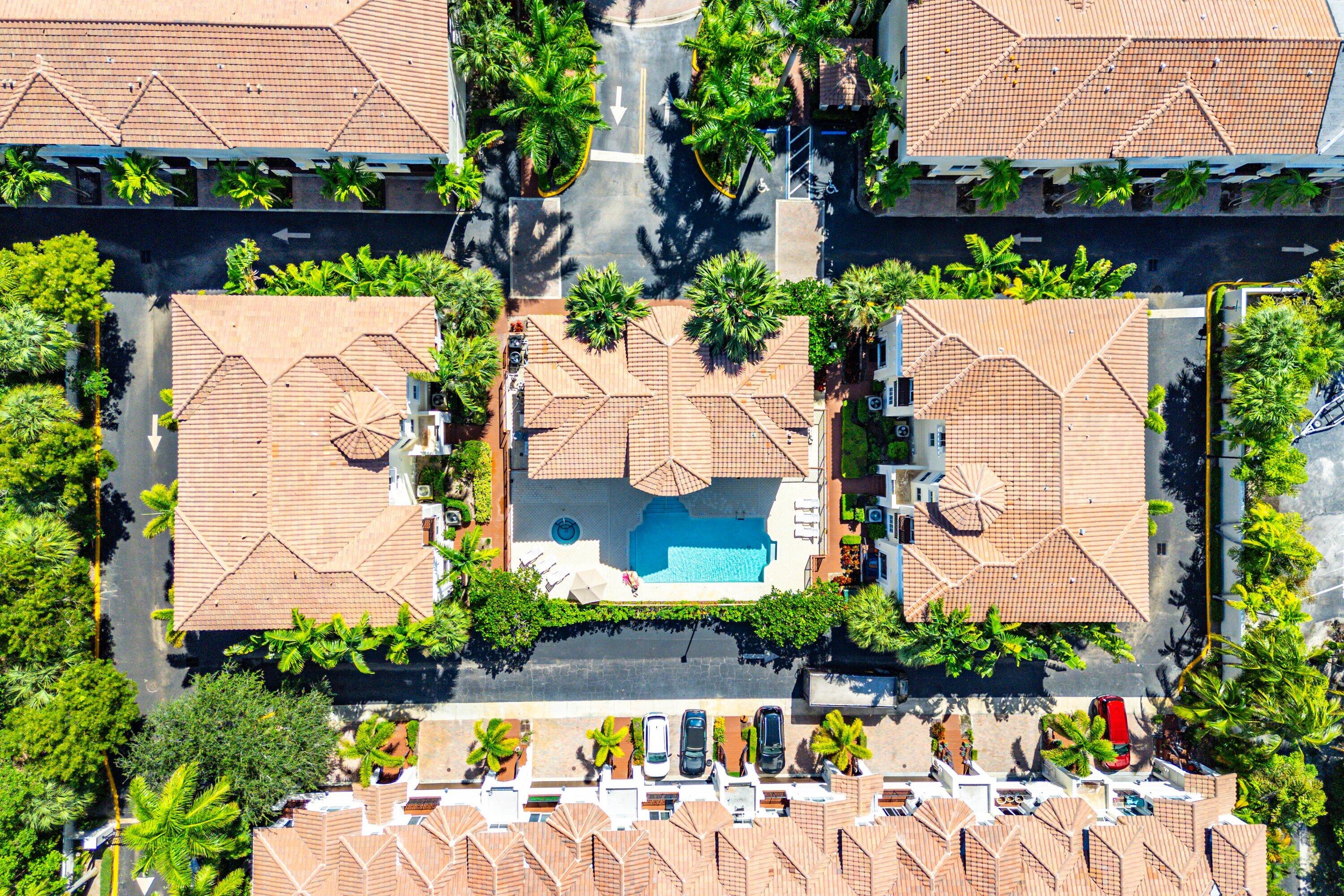 1910 Coastal Bay Boulevard Boynton Beach, FL 33435 - Photo 39 of 64 an aerial view of a house with a yard and a fountain