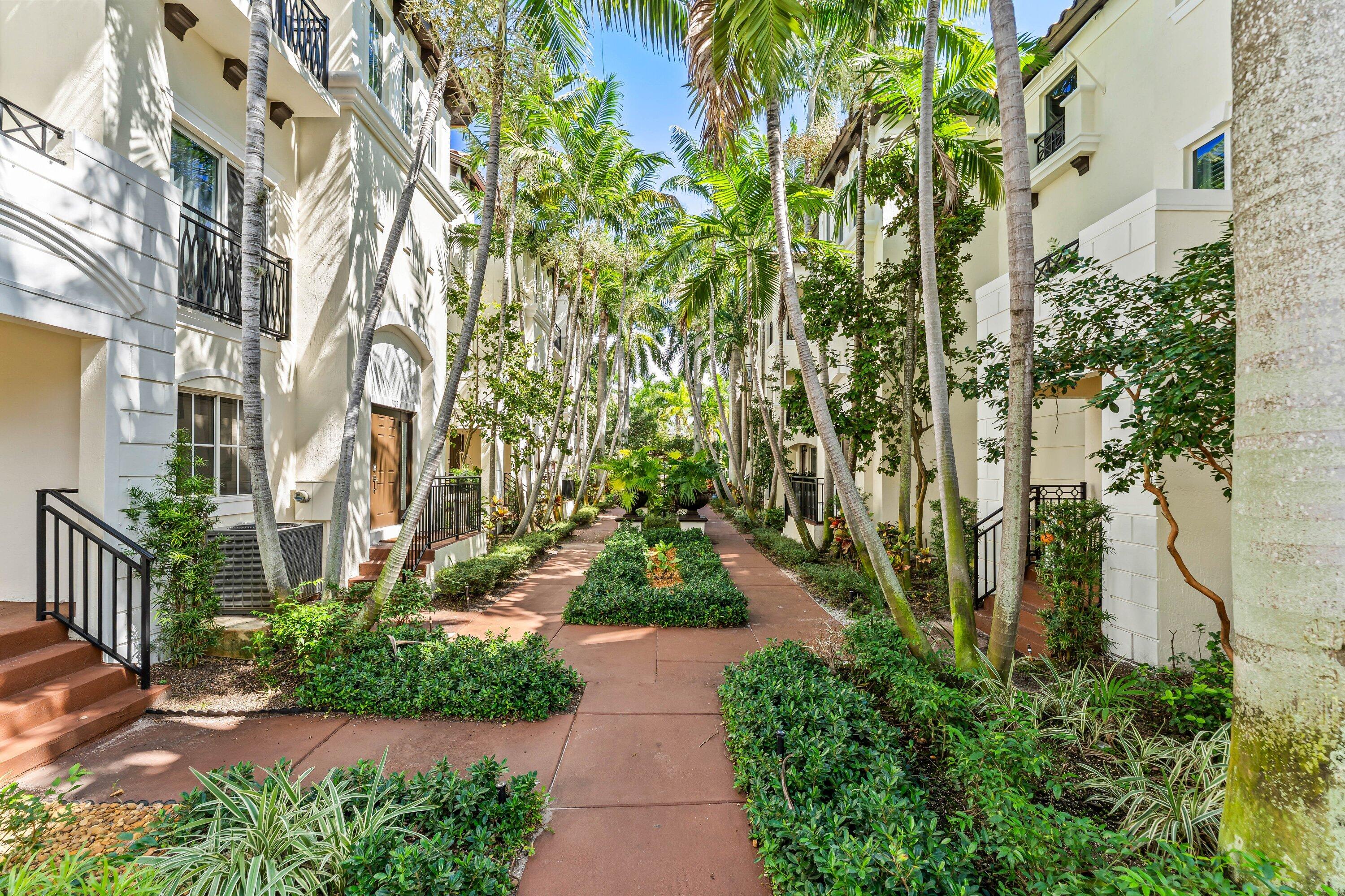 1910 Coastal Bay Boulevard Boynton Beach, FL 33435 - Photo 50 of 64 a view of a pathway with house on both side