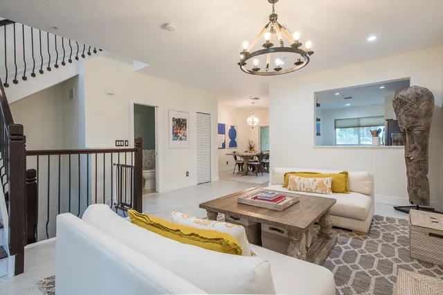 a living room with furniture and a table