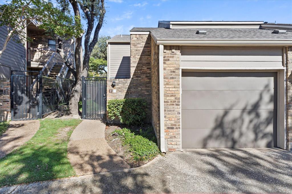 5616 Preston Oaks Road, Unit 208 Dallas, TX 75254 - Photo 11 of 16 a view of a house with a small yard