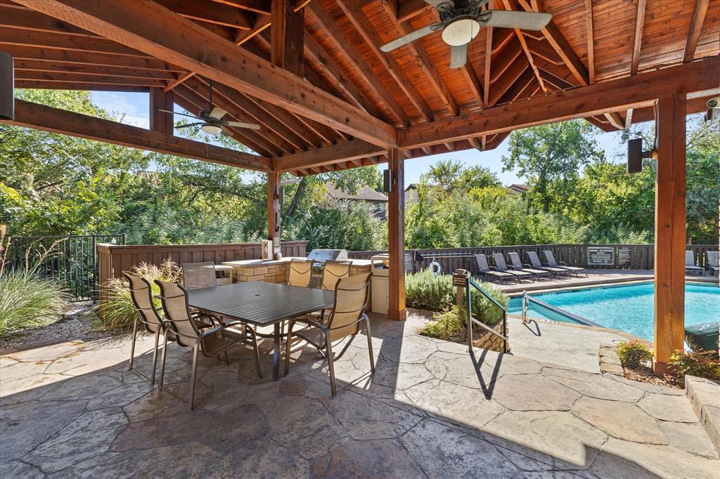 5616 Preston Oaks Road, Unit 208 Dallas, TX 75254 - Photo 14 of 16 a view of yard with table and chairs and wooden floor