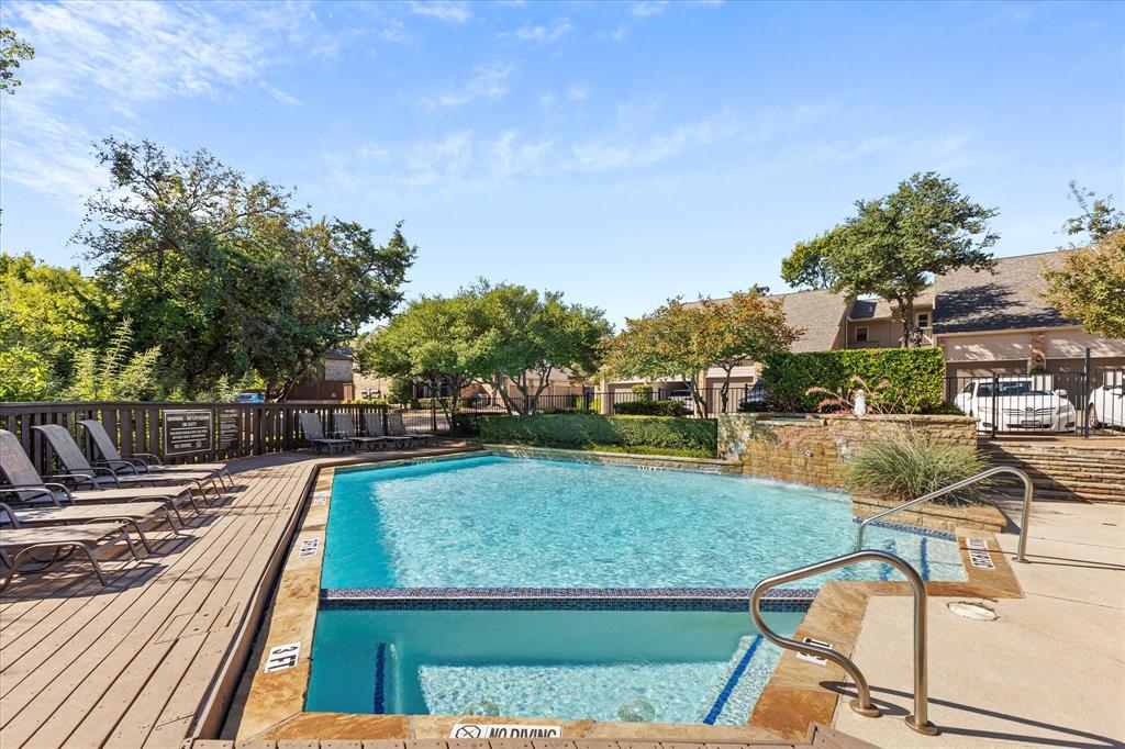 5616 Preston Oaks Road, Unit 208 Dallas, TX 75254 - Photo 15 of 16 a view of a swimming pool with a patio