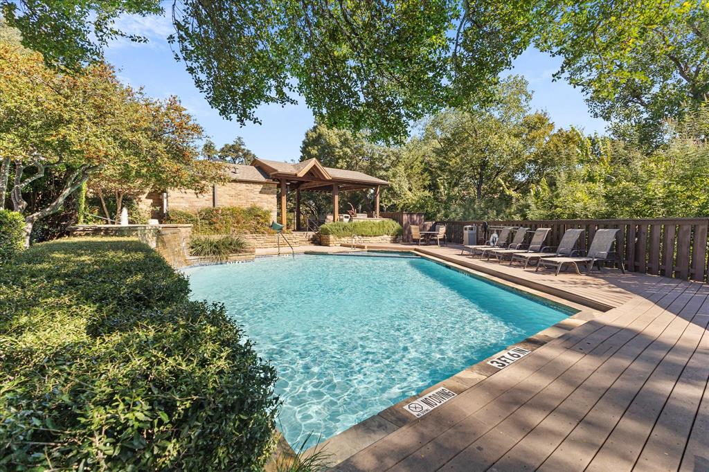 5616 Preston Oaks Road, Unit 208 Dallas, TX 75254 - Photo 16 of 16 a view of a house with a yard