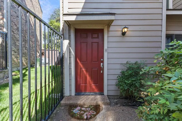a kitchen with kitchen island a sink appliances and cabinets