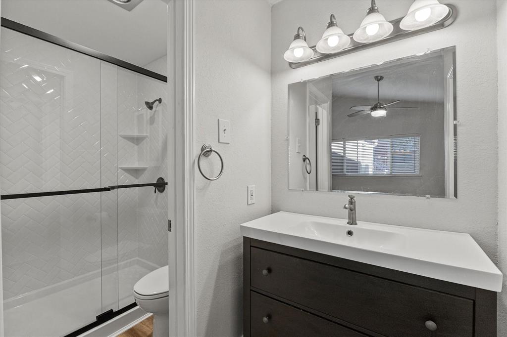 5616 Preston Oaks Road, Unit 208 Dallas, TX 75254 - Photo 5 of 16 a bathroom with a double vanity sink mirror and shower