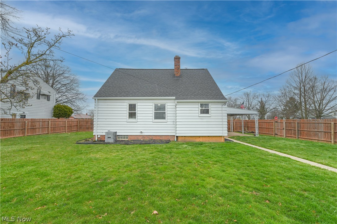 8301 Ackley Road Parma, OH 44129 - Photo 45 of 47 Rear view of property with a yard