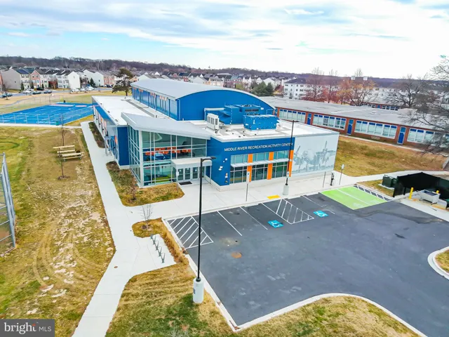 an aerial view of a house with a swimming pool