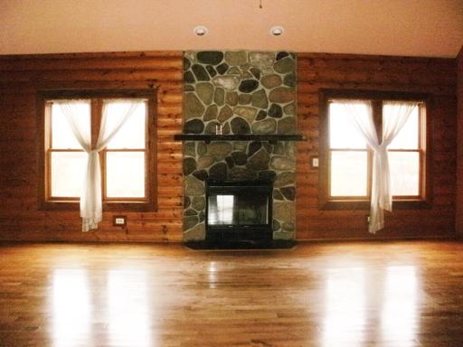 1784 North 46th Road Leland, IL 60531 - Photo 2 of 16 an empty room with wooden floor and windows