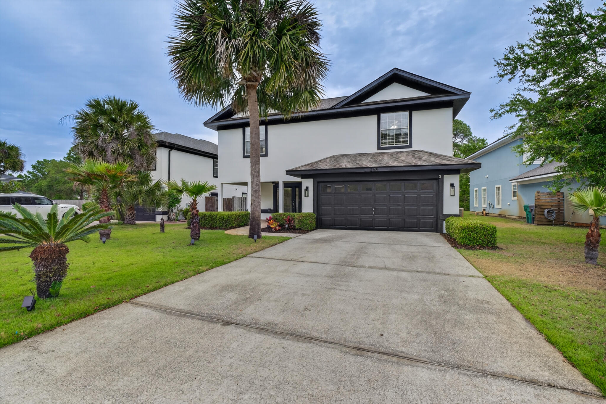 268 Loblolly Bay Drive Santa Rosa Beach, FL 32459 - Photo 61 of 73 a front view of a house with a yard and garage