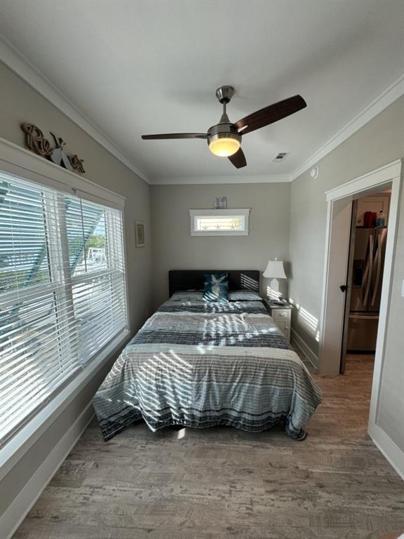 101 11th Street Marathon, FL 33051 - Photo 9 of 27 a bedroom with a large bed and a large window