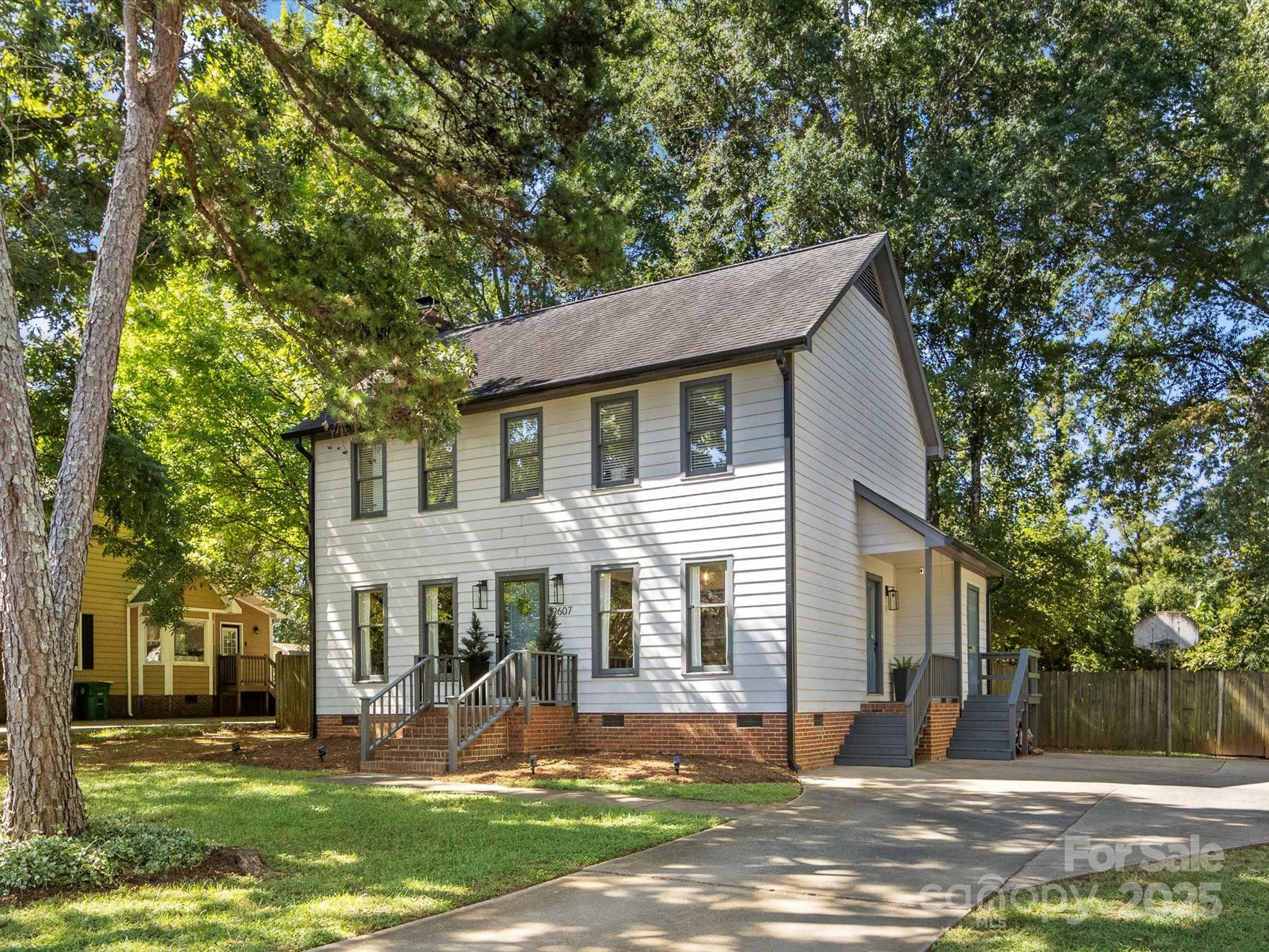 19607 Tryon Street Cornelius, NC 28031 - Photo 1 of 40 a view of a house with a yard