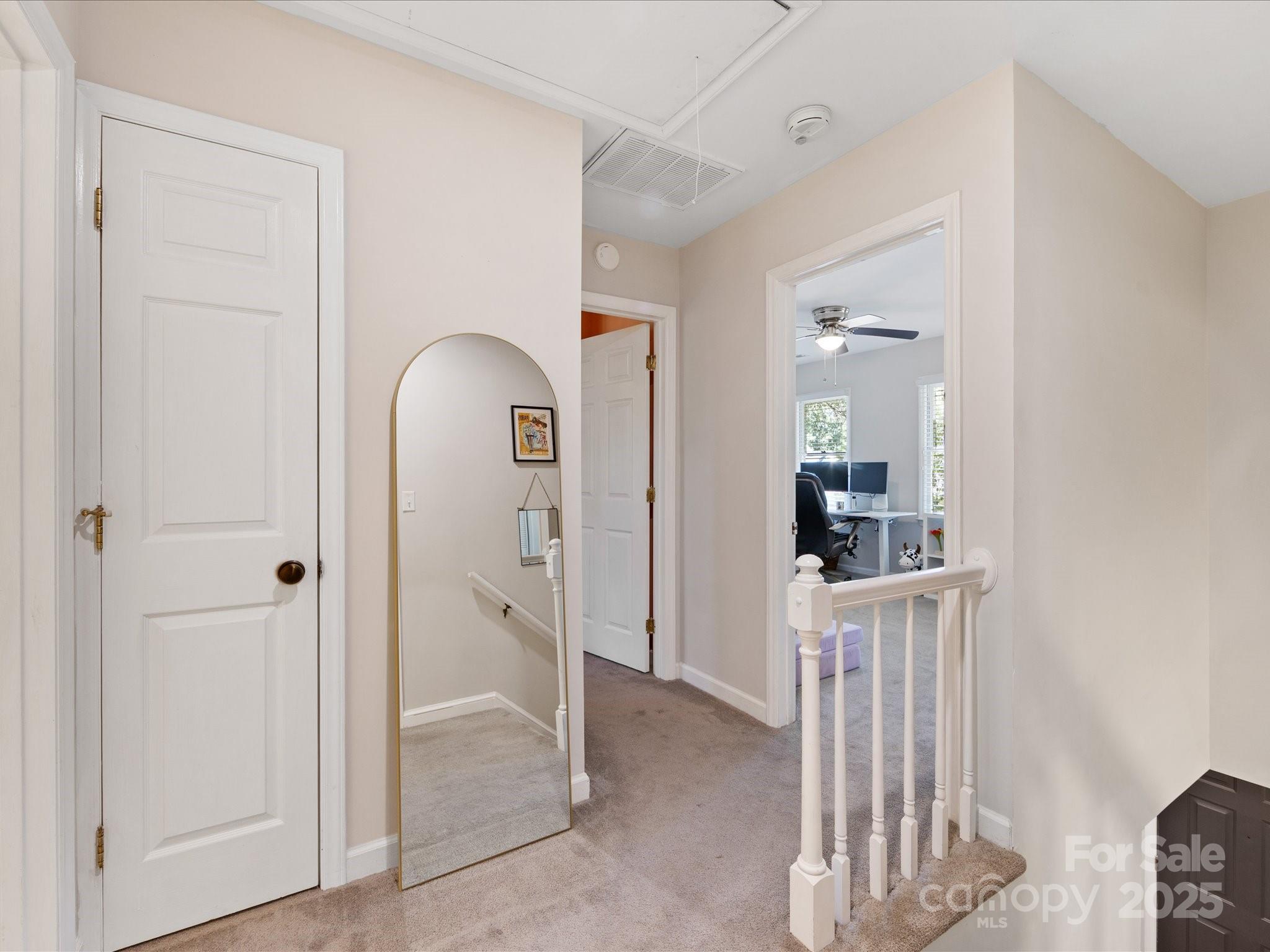 19607 Tryon Street Cornelius, NC 28031 - Photo 23 of 40 view of a livingroom with wooden floor and closet area