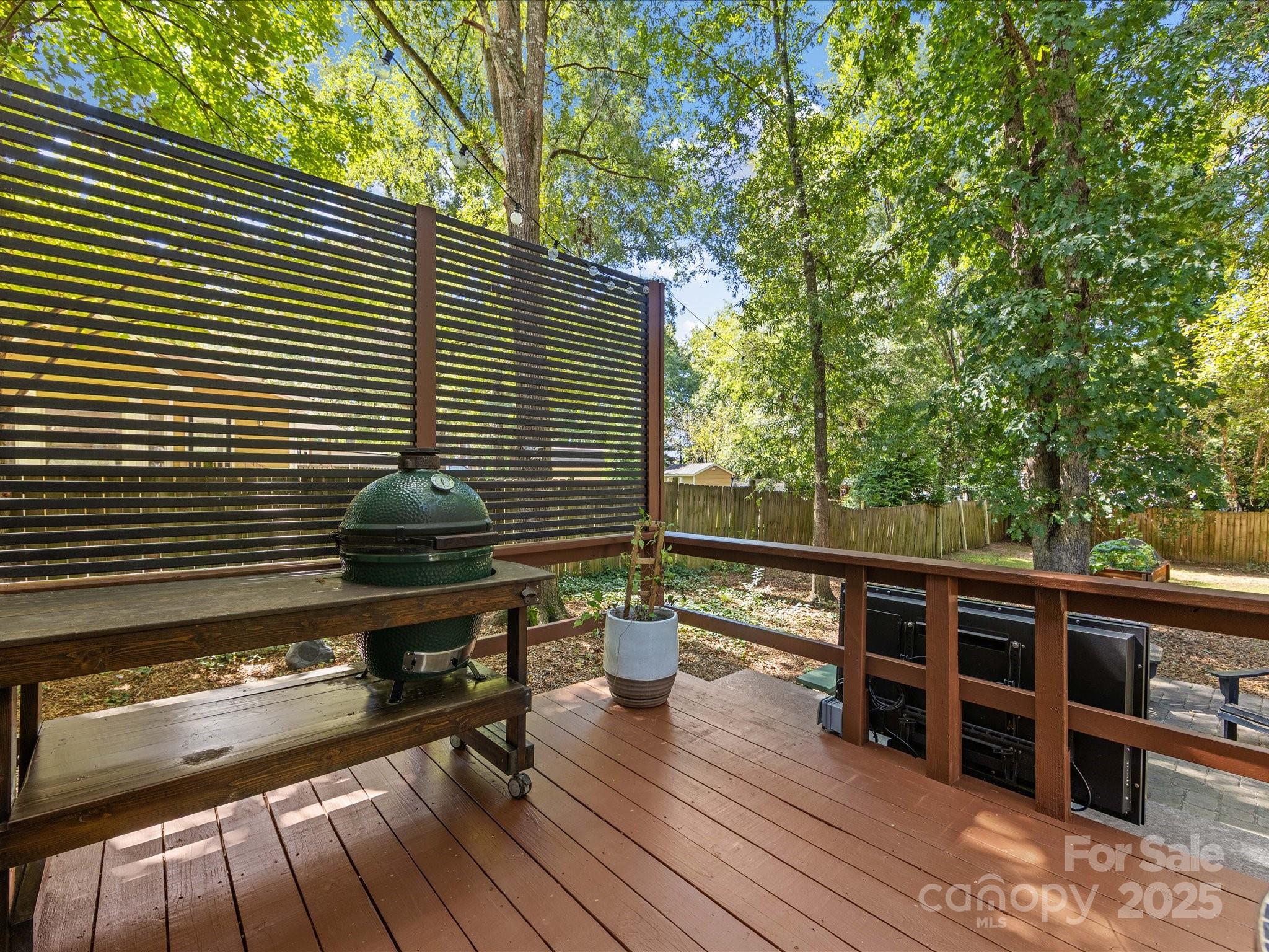 19607 Tryon Street Cornelius, NC 28031 - Photo 32 of 40 a view of a chairs and table on the wooden deck