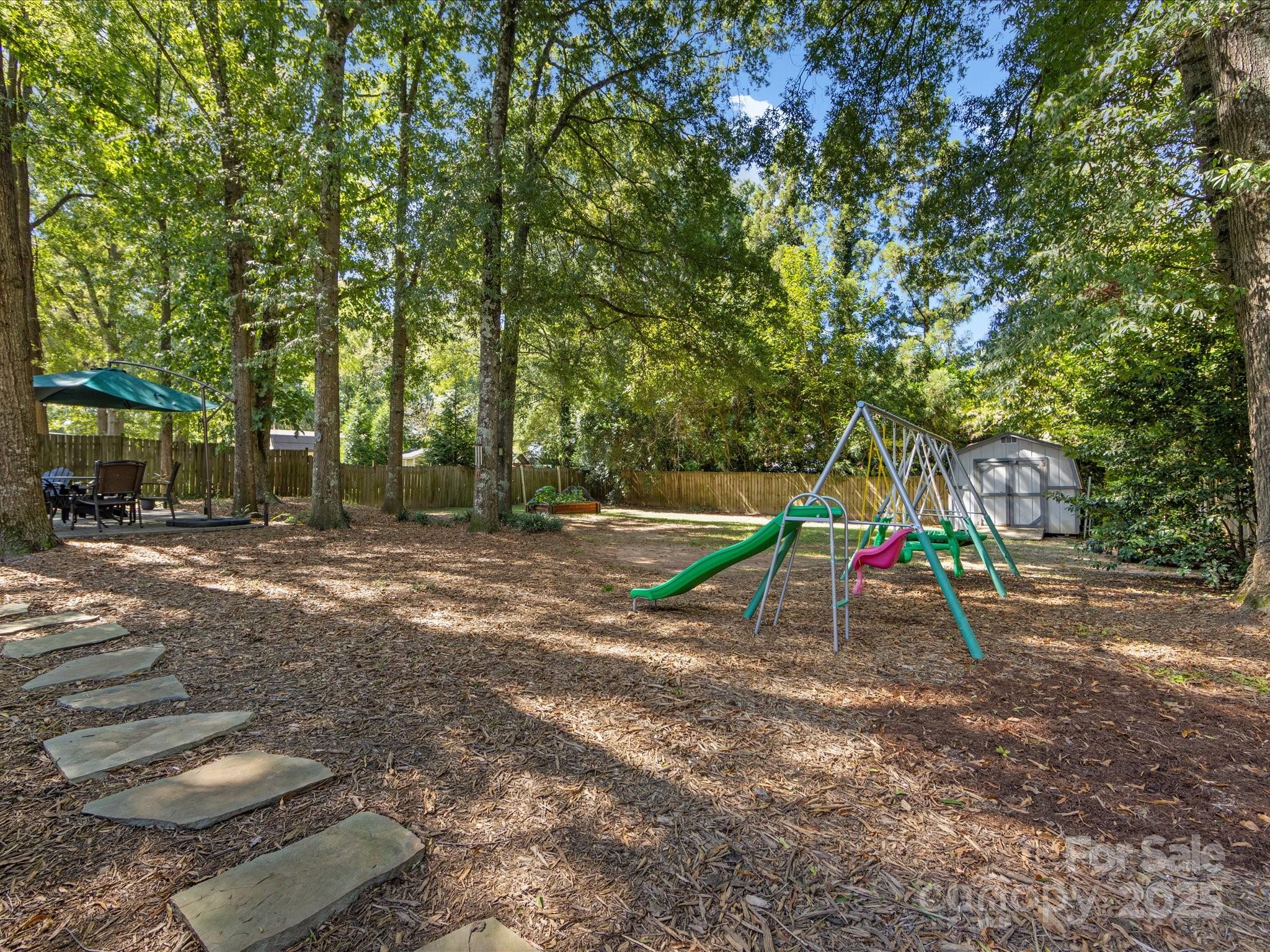 19607 Tryon Street Cornelius, NC 28031 - Photo 37 of 40 a view of outdoor space with playground and green space
