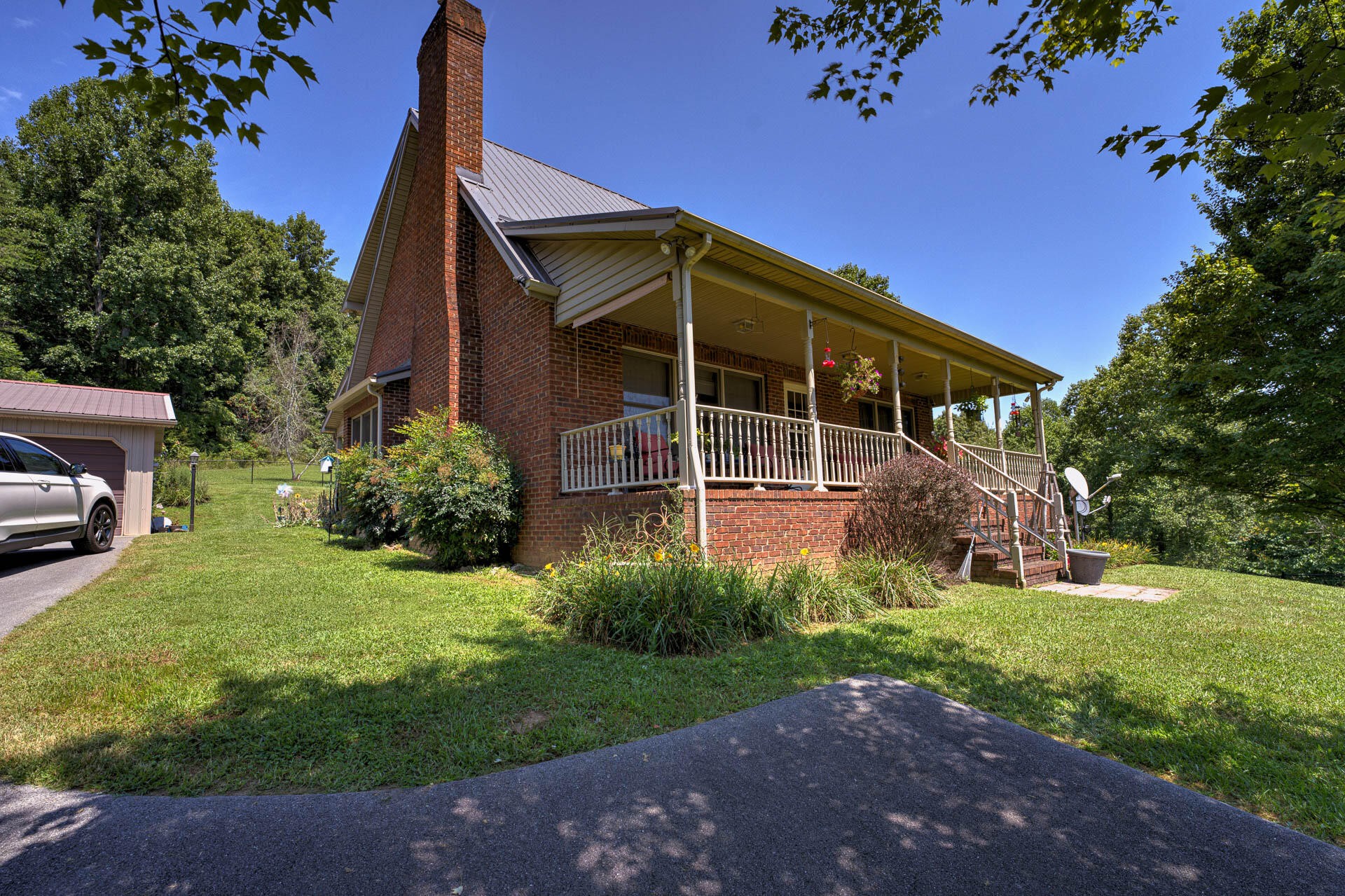 286 Oss Williams Road Limestone, TN 37681 - Photo 2 of 45 a view of a house with backyard and garden
