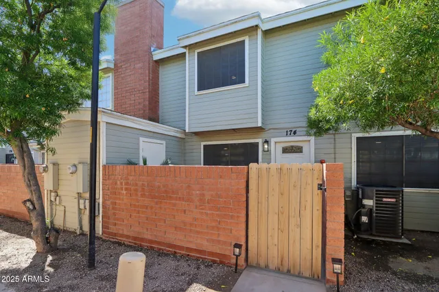a view of a house with a backyard