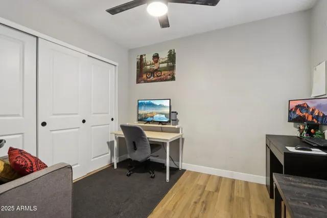 a workspace with furniture and wooden floor