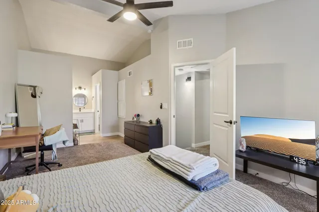 a bedroom with a workspace