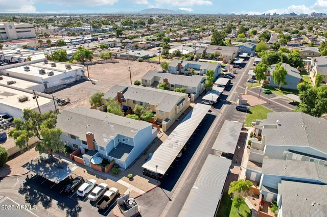an aerial view of residential houses with outdoor space