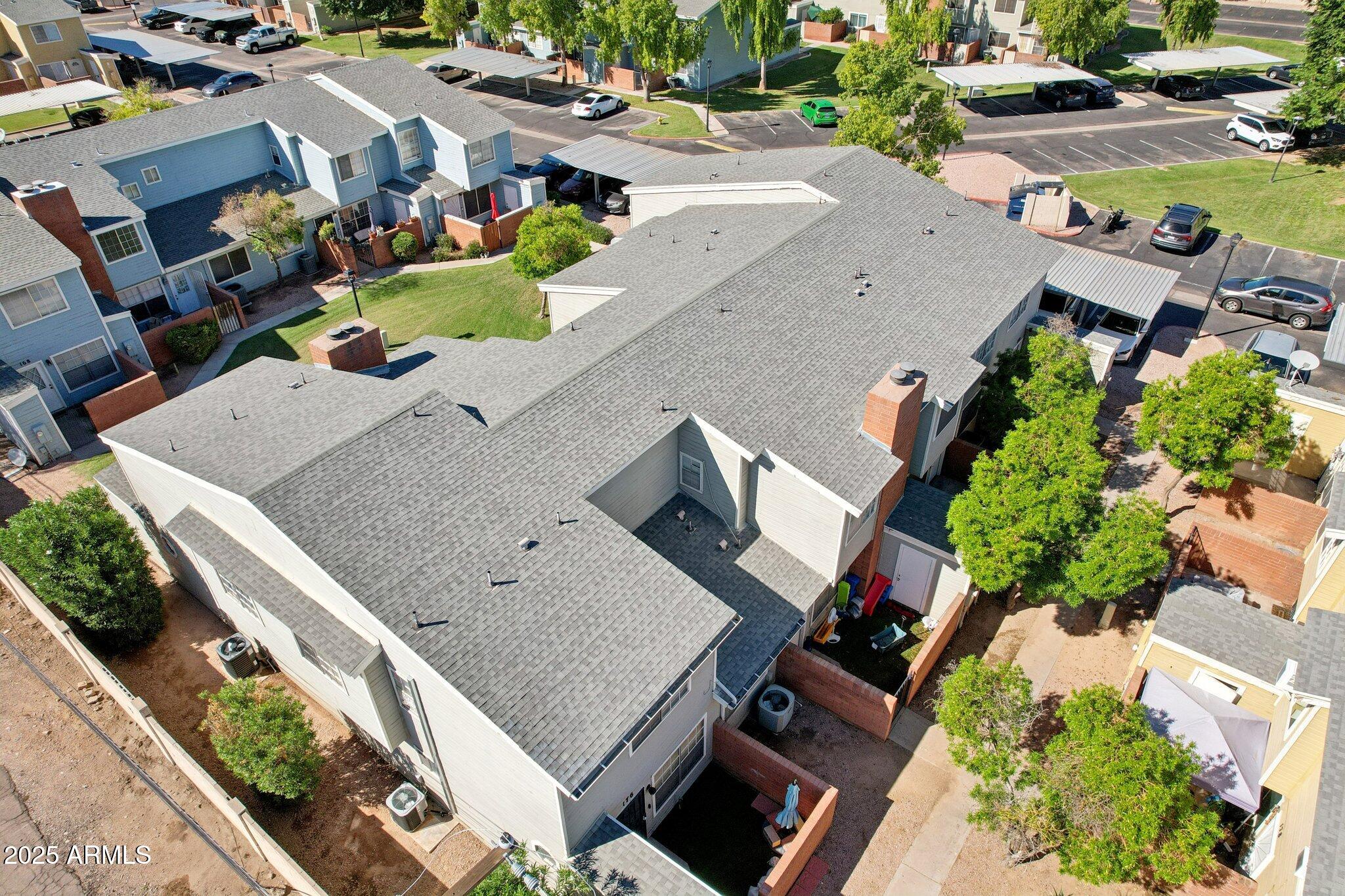 510 North Alma School Road, Unit 174 Mesa, AZ 85201 - Photo 35 of 38 an aerial view of residential houses with outdoor space
