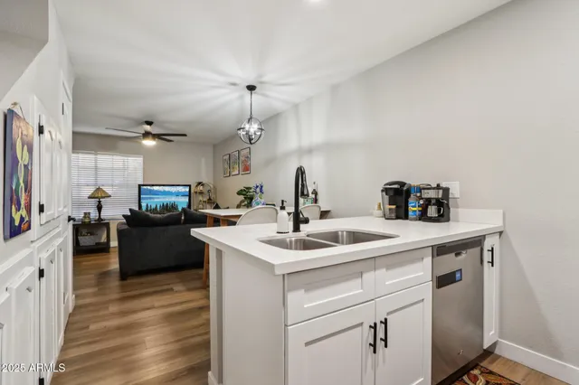 a kitchen with a sink and cabinets