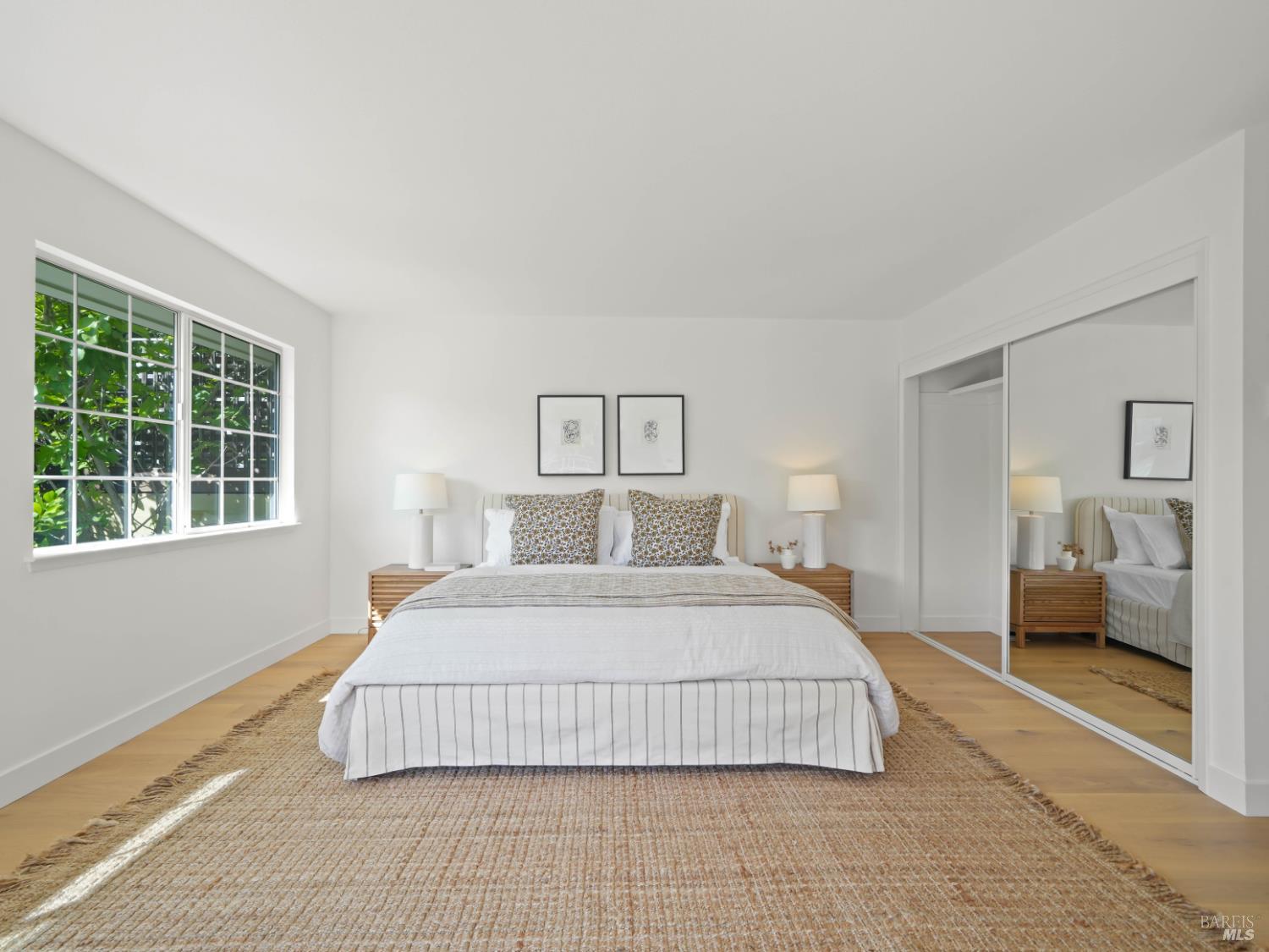 148 Dominican Drive San Rafael, CA 94901 - Photo 24 of 60 a bedroom with a large bed and a large window