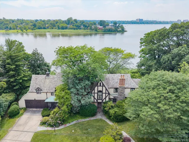 a view of a lake with a house in the background