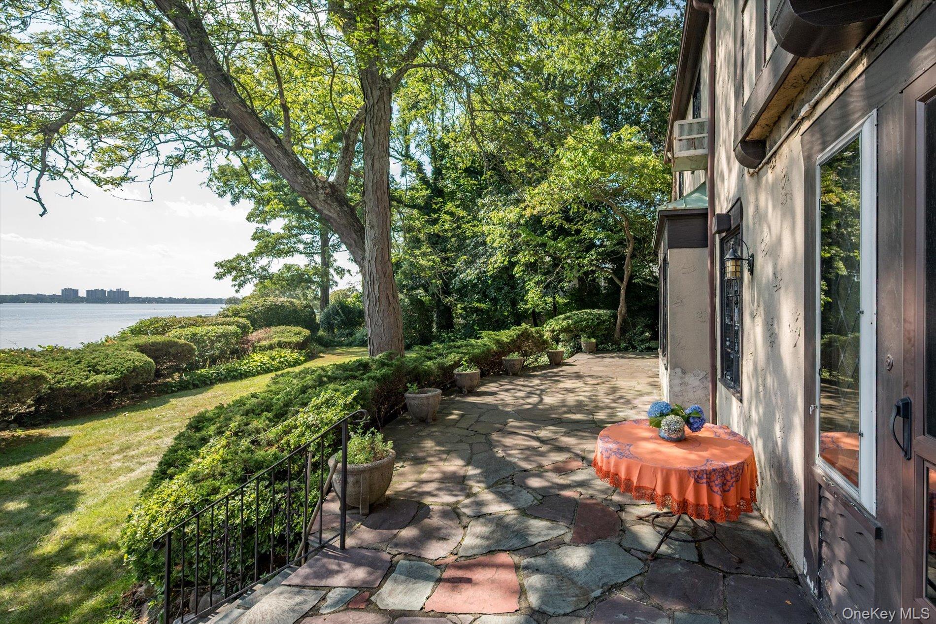 6 Shore Drive Great Neck, NY 11021 - Photo 7 of 10 View of patio / terrace with a water view