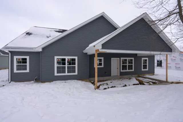 a front view of house with garage