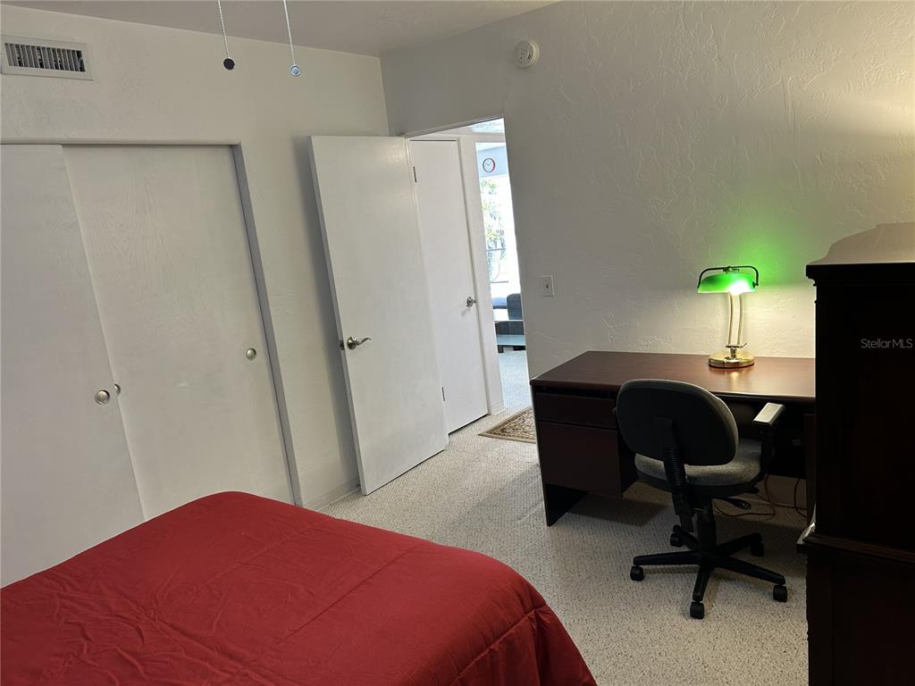 4154 57th Street North, Unit 274 Kenneth City, FL 33709 - Photo 15 of 28 a bedroom with a workspace